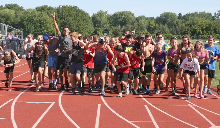 Cross country team running on track