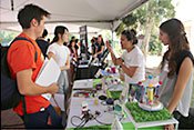 Students talking to company representatives.