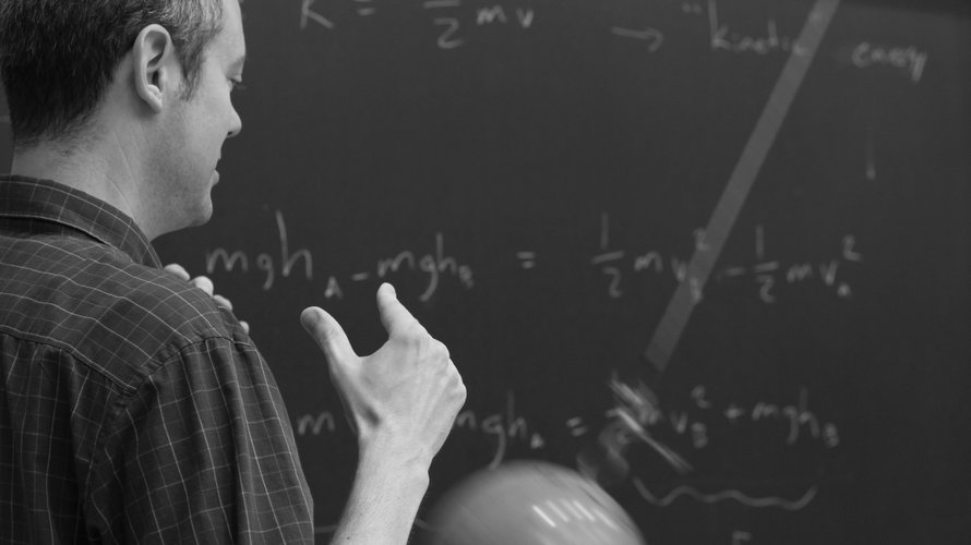 Physics professor doing a pendulum motion demo in Ph 1 a