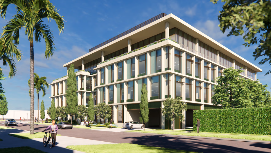 glass and concrete building with blue sky above