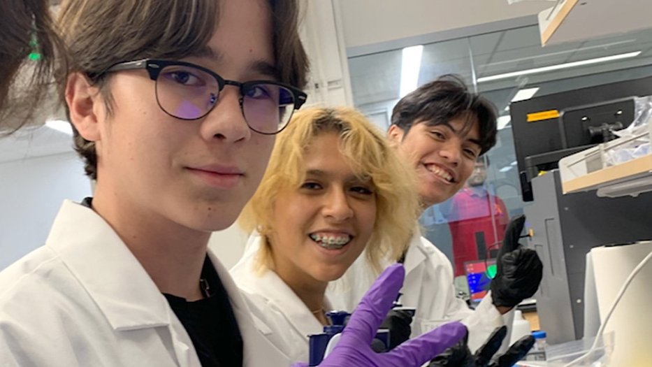 students wearing white lab coats