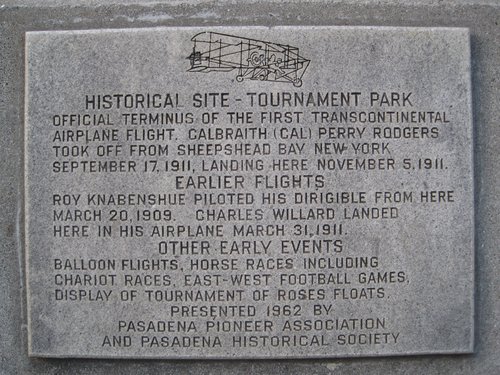 Tournament Park historical marker. The text reads (in all capital letters): Historical Site—Tournament Park. Official terminus of the first transcontinental airplane flight, Calbraith (Cal) Perry Rodgers took off from Sheepshead Bay New York September 17, 1911, landing here November 5, 1911. Earlier flights. Roy Knabenshue piloted his dirigible from here March 20, 1909. Charles Willard landed here in his airplane March 31, 1911. Other early events. Balloon flights, horse races including chariot races, east-west football games, display of Tournament of Roses floats. Presented 1962 by Pasadena Pioneer Association and Pasadena Historical Society