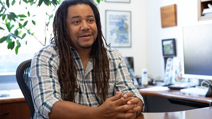 Professor Bil Clemons at his desk in his office