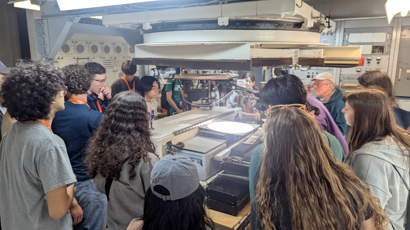 Students attend a lab facility tour during DiscoTech