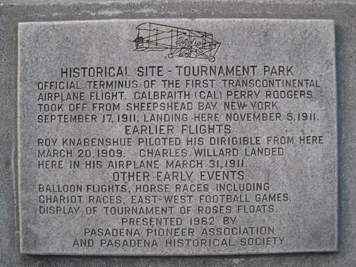 Tournament Park historical marker. The text reads (in all capital letters): Historical Site—Tournament Park. Official terminus of the first transcontinental airplane flight, Calbraith (Cal) Perry Rodgers took off from Sheepshead Bay New York September 17, 1911, landing here November 5, 1911. Earlier flights. Roy Knabenshue piloted his dirigible from here March 20, 1909. Charles Willard landed here in his airplane March 31, 1911.  Other early events. Balloon flights, horse races including chariot races, east-west football games, display of Tournament of Roses floats. Presented 1962 by Pasadena Pioneer Association and Pasadena Historical Society