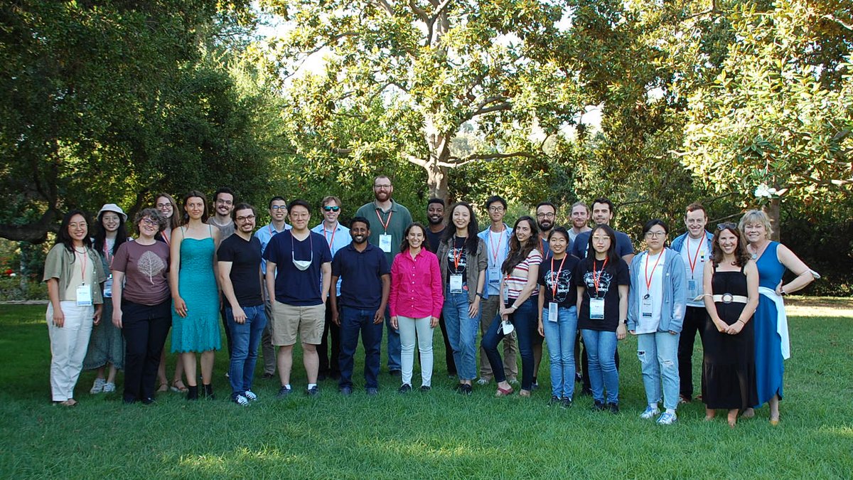 DataSAI Summer School Students and organizers standing in on grass in a garden