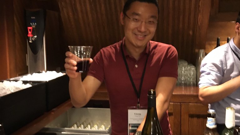 Yisong Yue behind the bar
