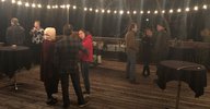 People chatting at the bonfire