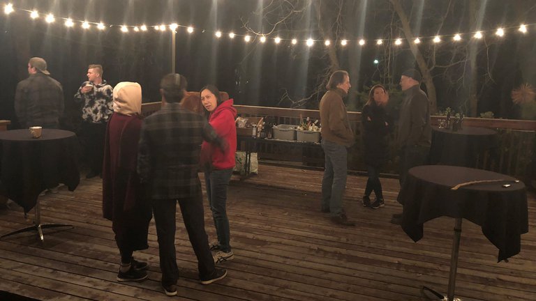 People chatting at the bonfire