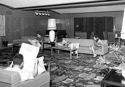 Black and white image of students reading and relaxing in the Winnett Center circa 1960