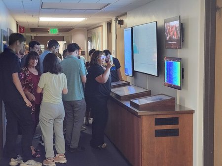 Caltech community members look at earthquake waveforms on display in the Seismo Lab after a magnitude 4.4 quake rattled campus