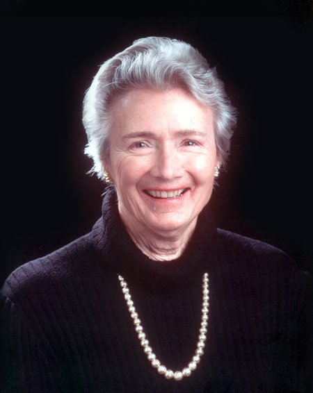 A smiling woman looking into the camera