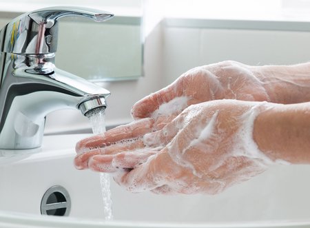 Photo of hand washing.