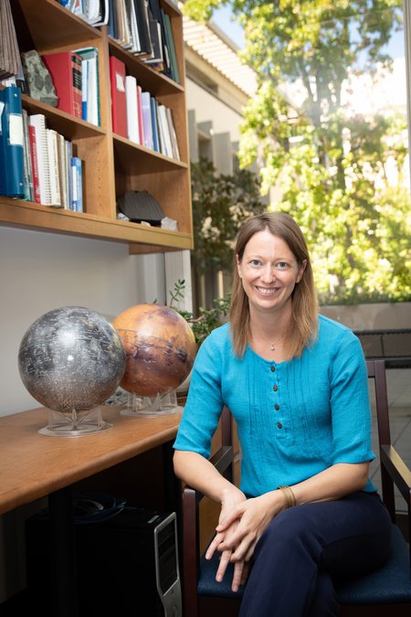 Image of Bethany Ehlmann in office wearing blue shirt.