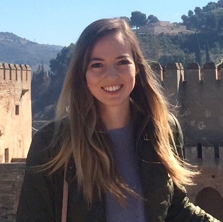 A woman smiles for a photo