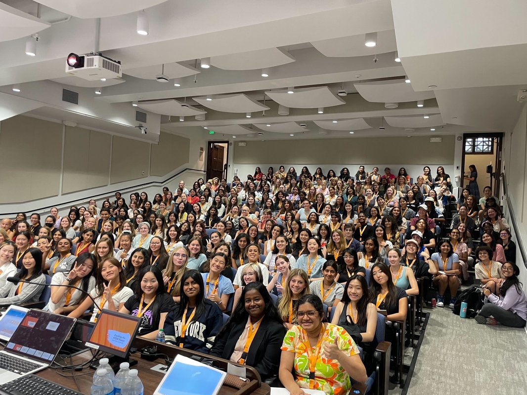 WiSTEM 2023 attendees pose for a group photo.