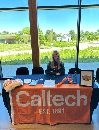 Noelle Wilkinson at a Caltech booth at her high school