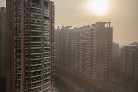 High-rise apartment buildings are shrouded by air pollution in Shanghai.