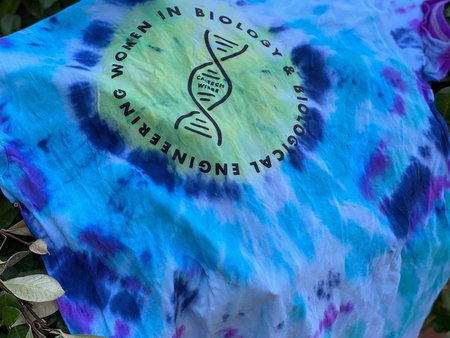 a blue tie dye t-shirt with the logo for women in BBE